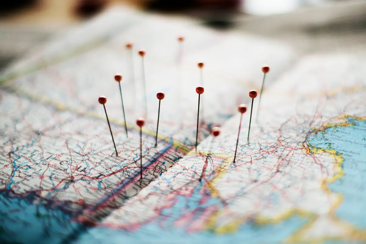 Pins on a road map, planning a route